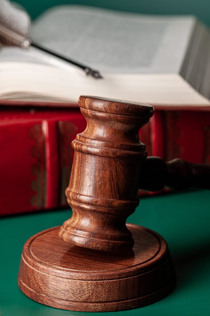 court mallet sitting next to book